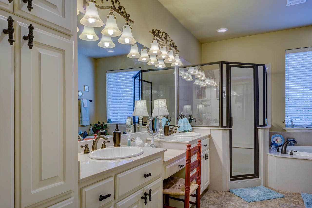 White clawfoot tub on a black and white tile floor